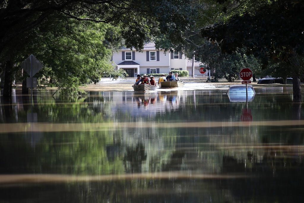Residents in a neighborhood near the Barker Reservoir return to their homes to collect belongings. <br>